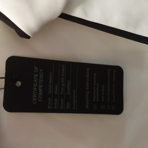 White 3/4 sleeve dress, with black trim & bow detail - Picture 7 of 8